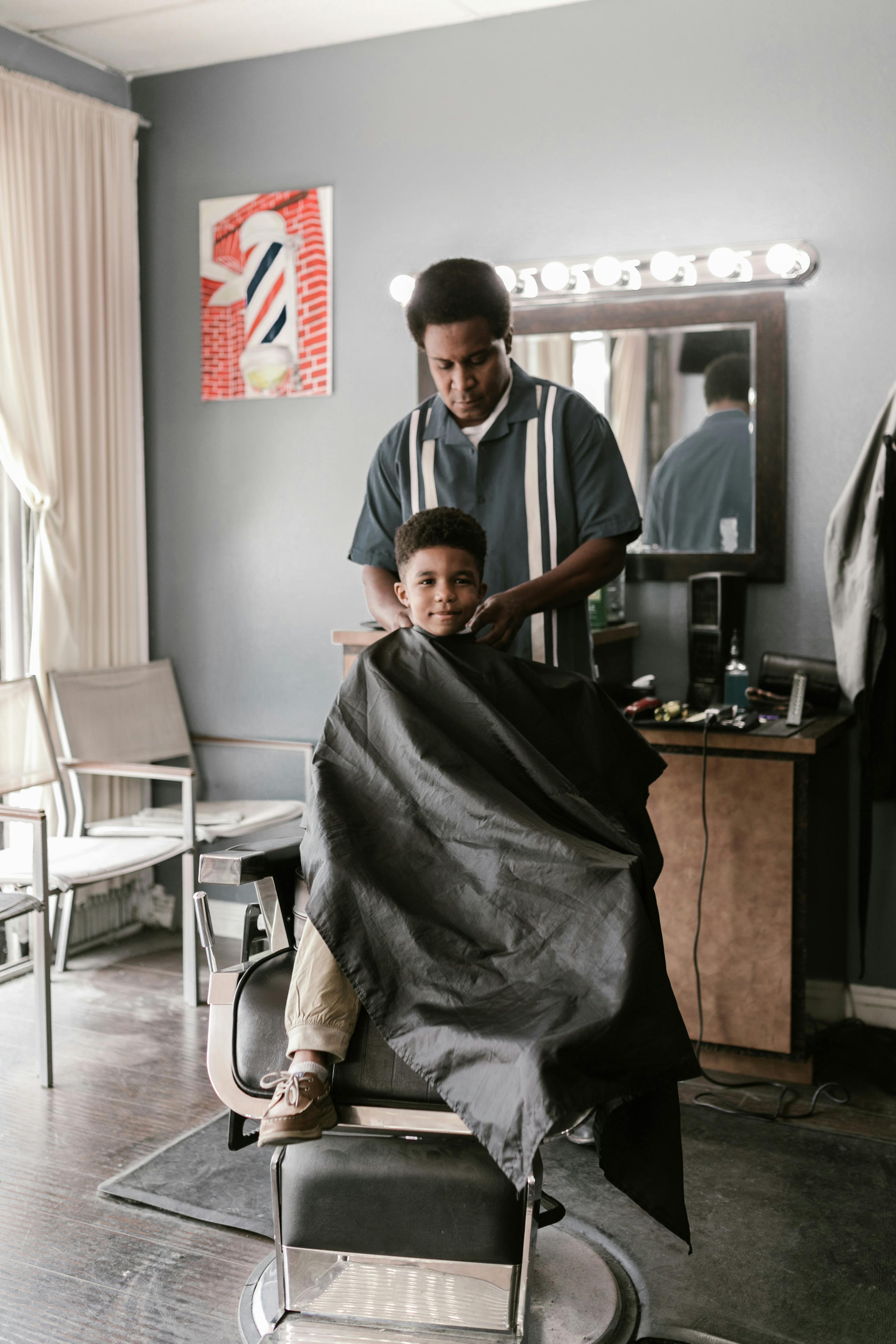 Kid getting a haircut at The Fade Room